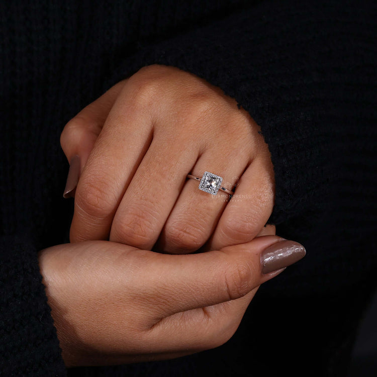 Exquisite princess cut halo ring in a sophisticated design.