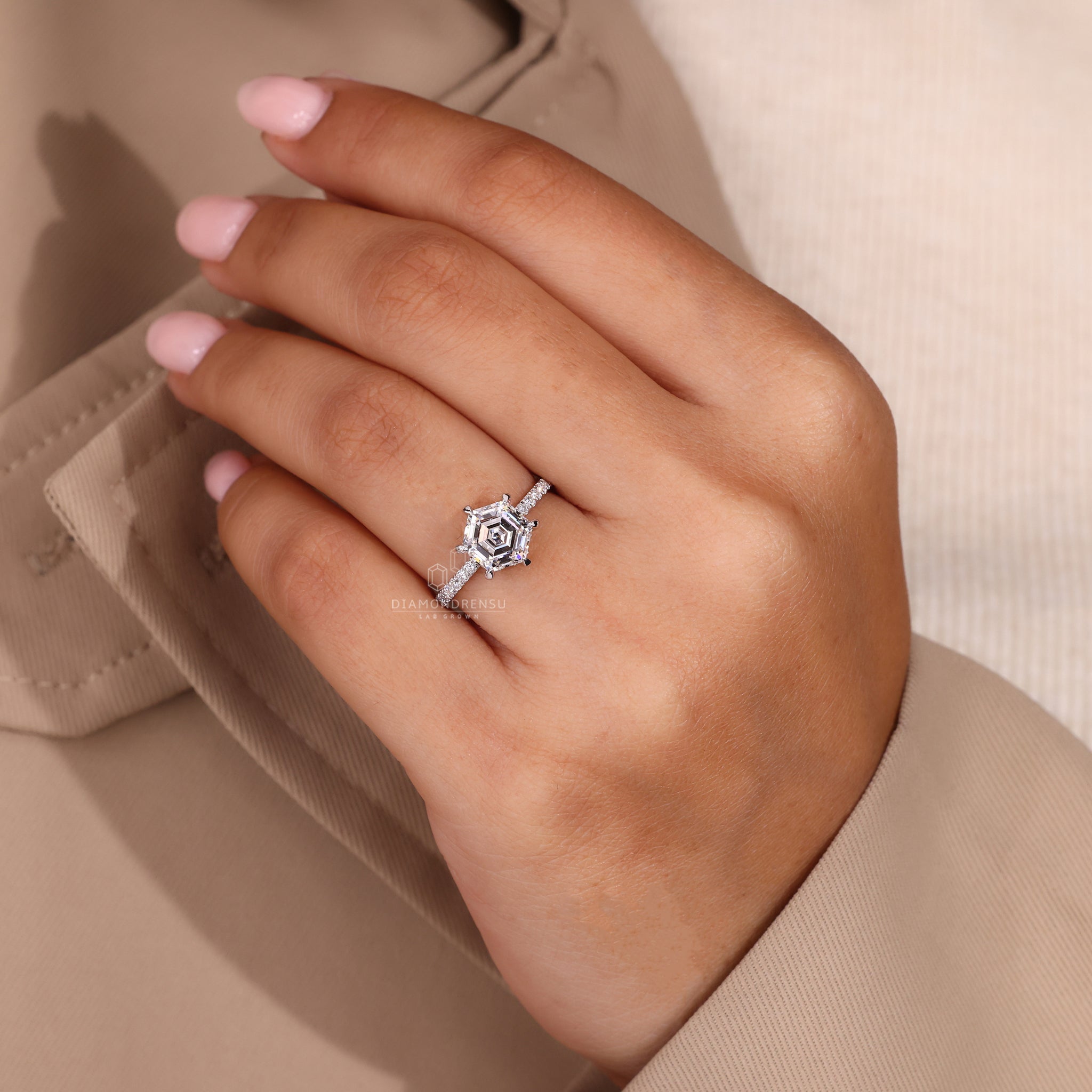 Handmade ring with hexagon design and hidden halo details.
