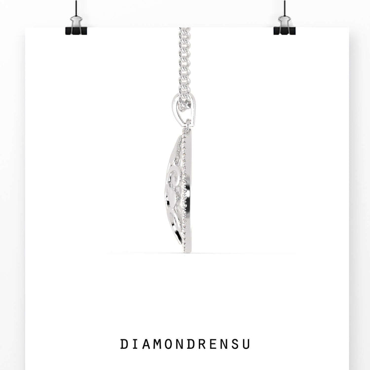 UK diamond pendant paired with matching gold tree pendant.
