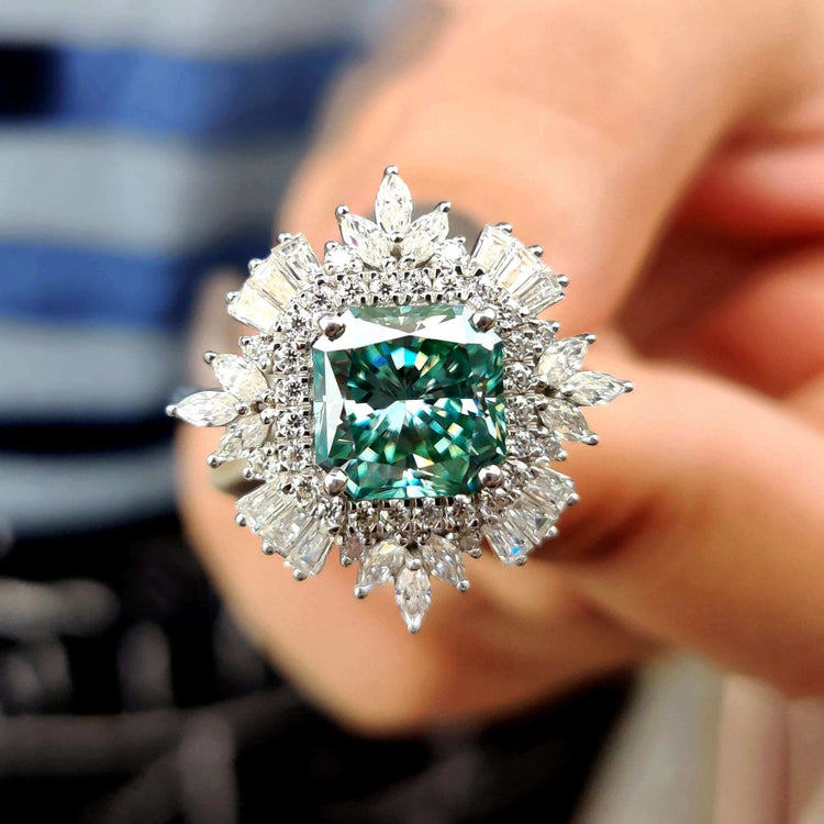 Vintage moissanite engagement ring with radiant cut center stone.
