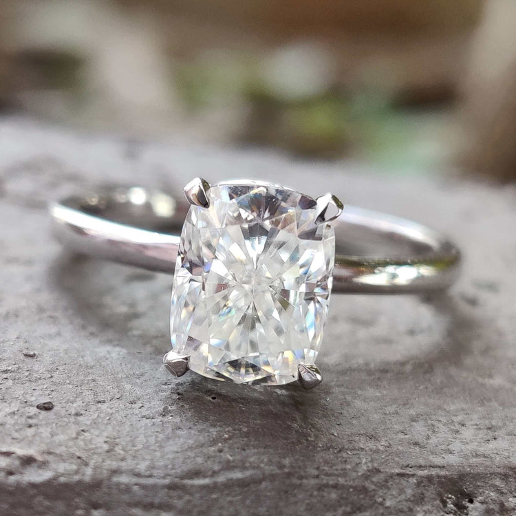 Elongated cushion moissanite engagement ring in white gold.
