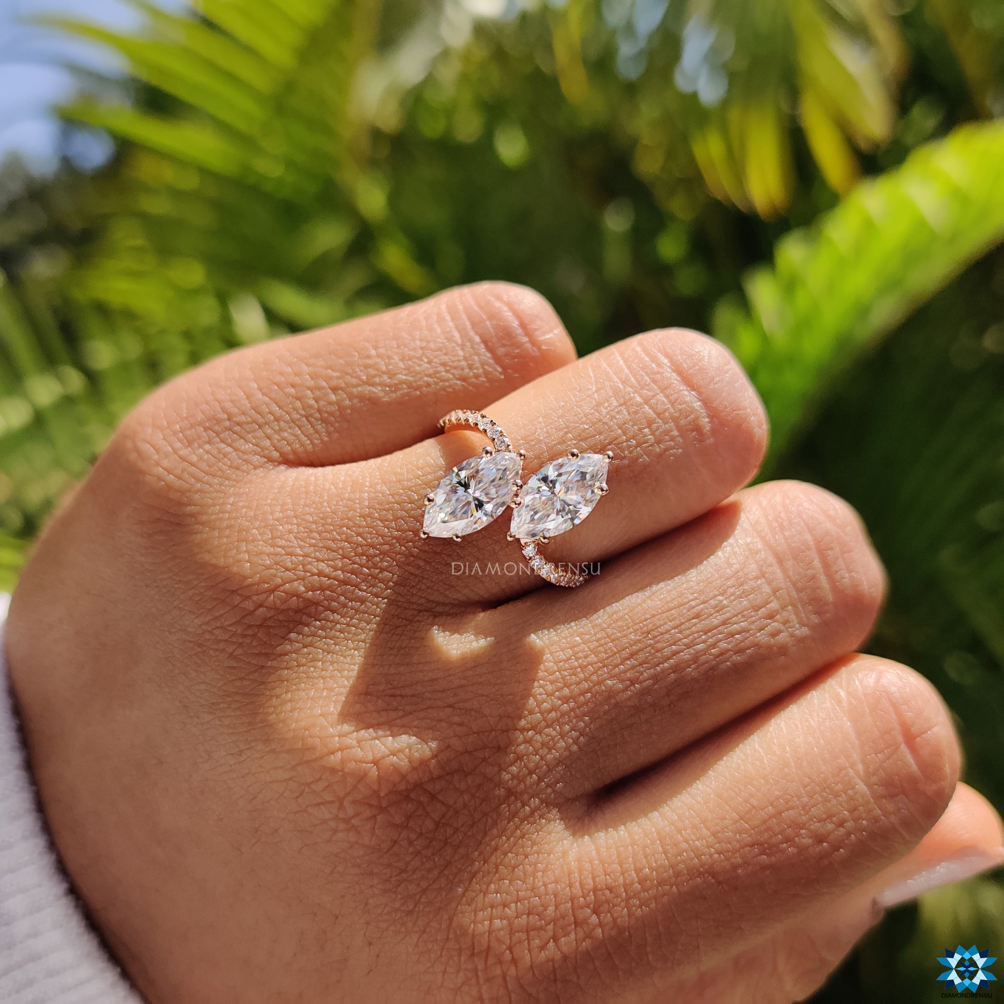 Moissanite ring UK with prong setting and round cut pave detailing.
