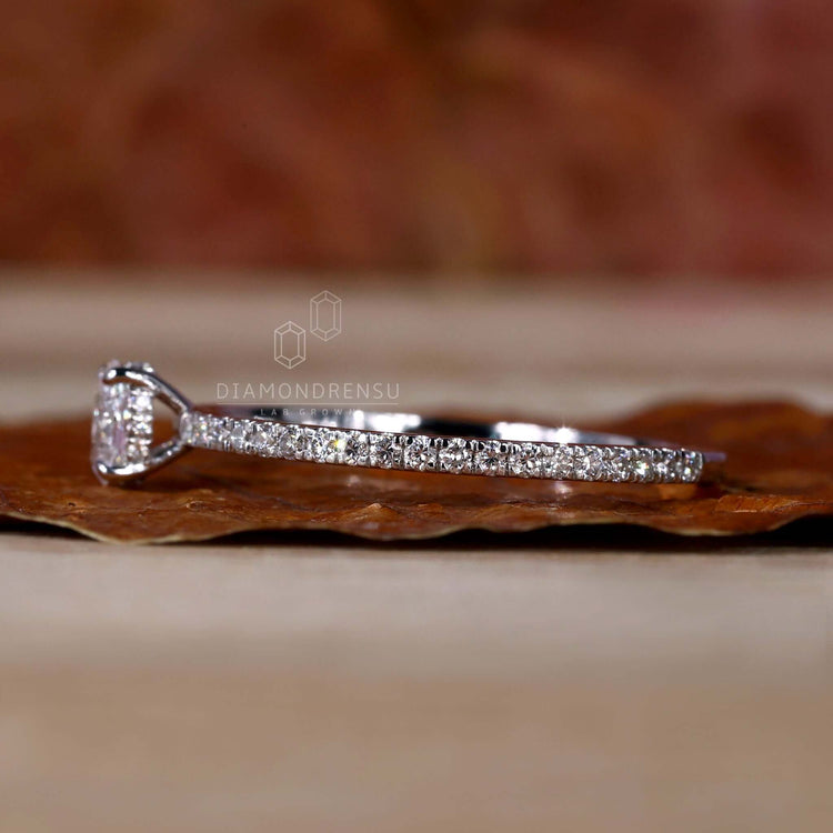 Oval hidden halo engagement ring crafted with pave diamonds, ideal for a romantic and elegant proposal.
