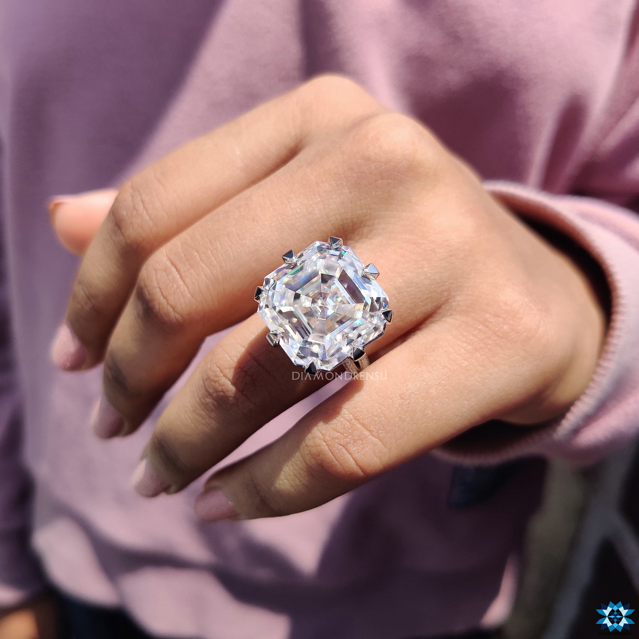 White gold engagement ring with Asscher cut and pave wrap band.
