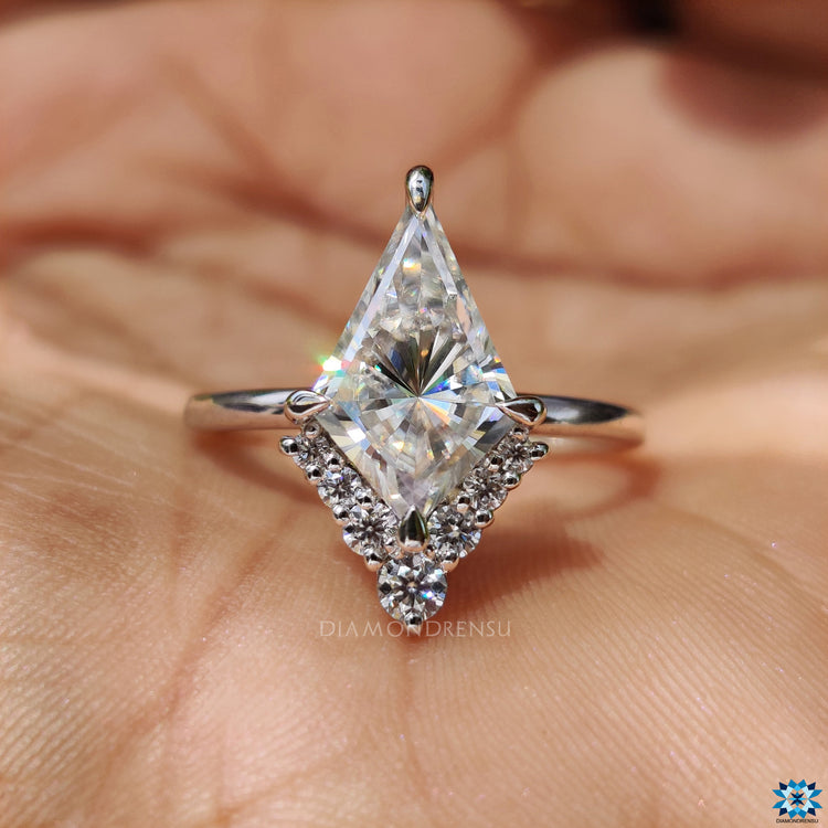 Buy engagement ring with kite cut moissanite and white gold band.
