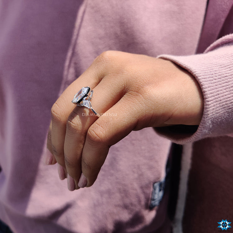 Moissanite for engagement ring styled with hexagon and kite side stones.
