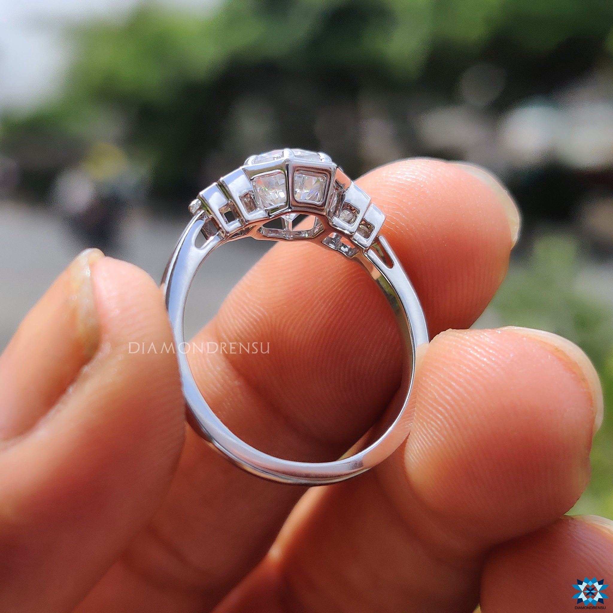 Moissanite ring UK made with baguette cuts and round centre brilliance.
