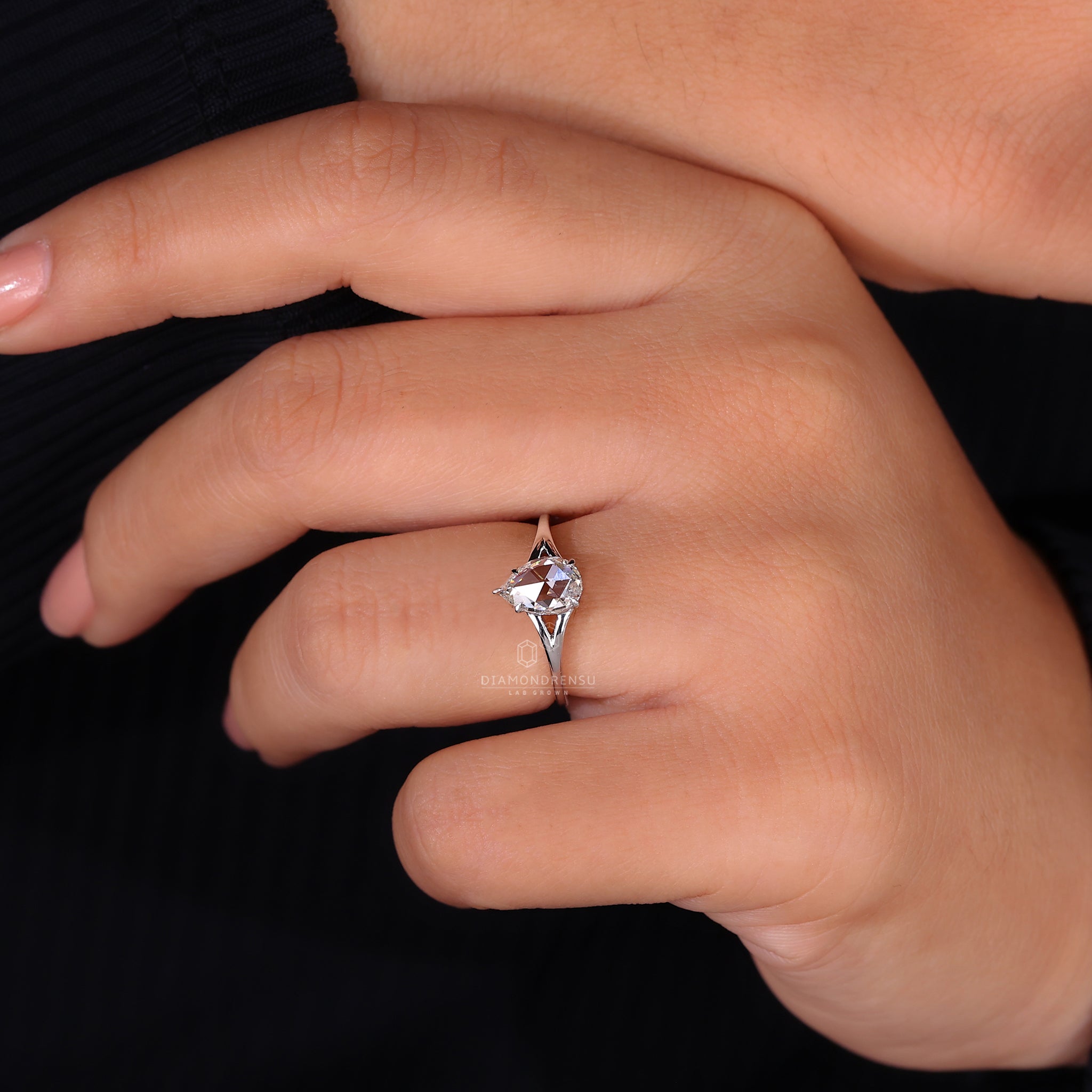 Prong setting keeps the pear rose cut diamond firm.
