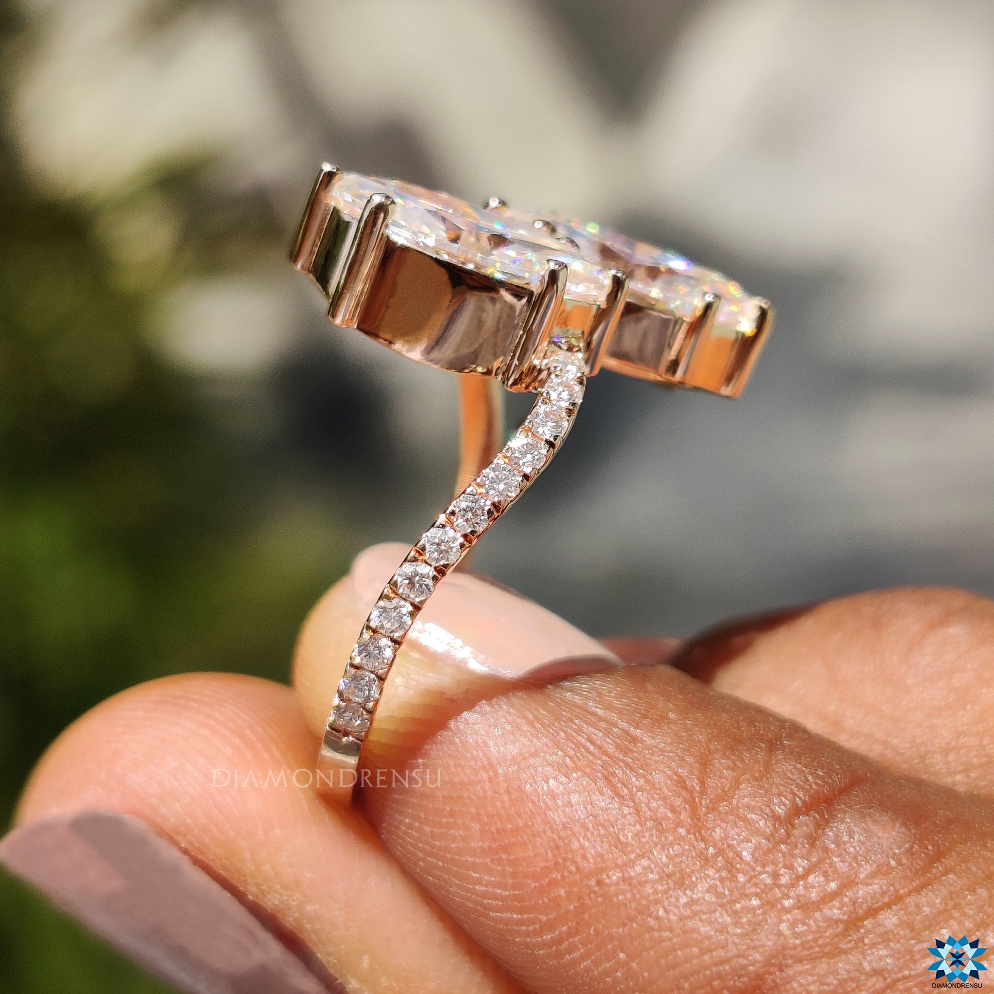 Diamondrensu UK engagement ring with two moissanite stones and wave pave.
