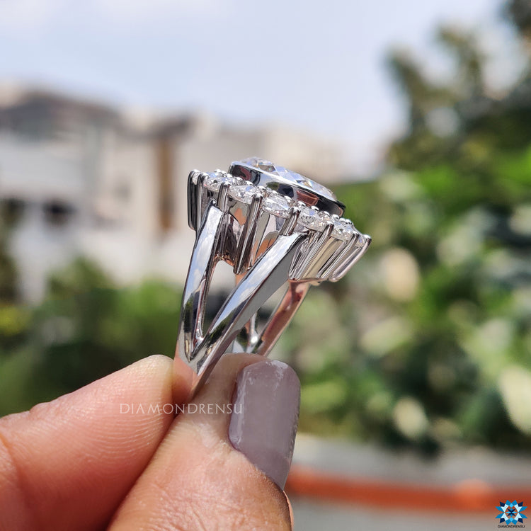 Buy engagement ring with vintage halo and trillion moissanite accent stones.
