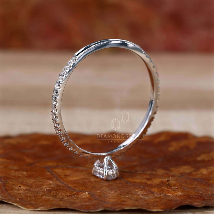 Oval diamond ring with a pave setting, combining modern design with traditional charm for a memorable UK engagement.
