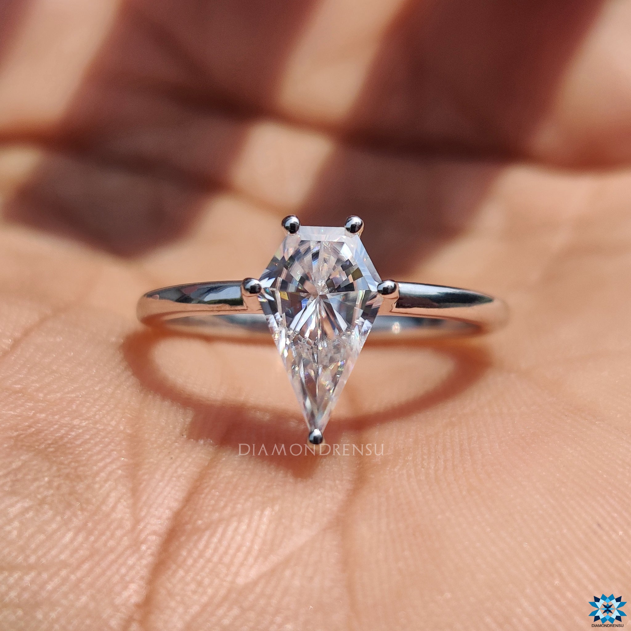 Handmade jewellery crafted in the UK with moissanite spear cut centre.
