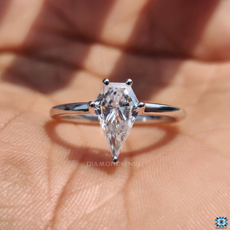 Handmade jewellery crafted in the UK with moissanite spear cut centre.
