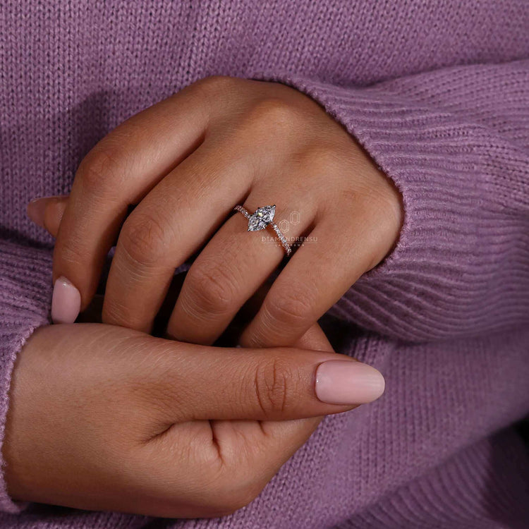 Marquise diamond engagement ring with pave diamonds and rose gold for a sophisticated and stylish look.