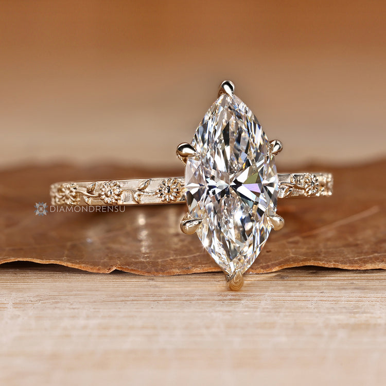 Marquise engagement ring with six claw prong setting.