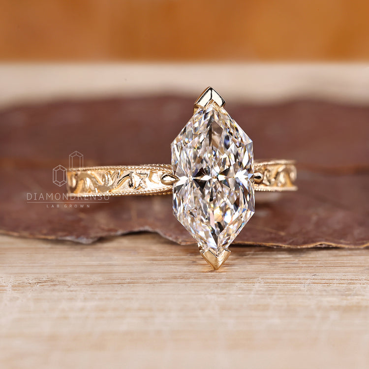 Handmade marquise diamond ring with milgrain and tapered band.