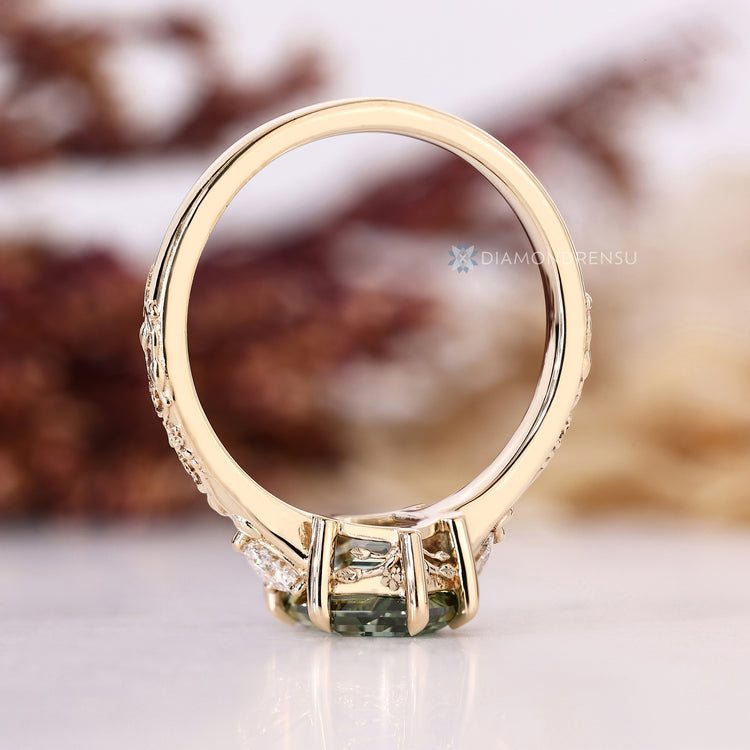 Hexagon cut engagement ring with trillion side diamonds.