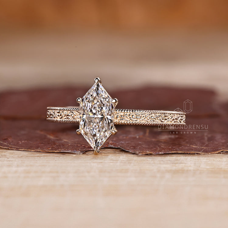 Handmade dutch marquise diamond ring with ocean wave pattern.
