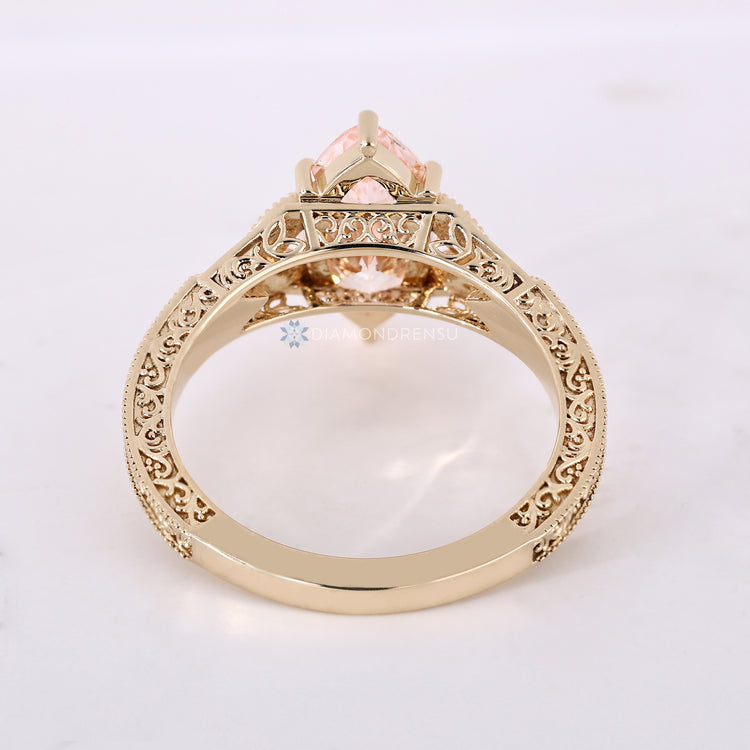Art Deco engagement ring with six claw prong.