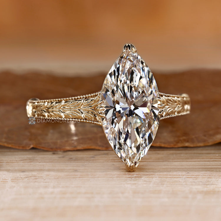 Handmade marquise diamond ring with cathedral setting.