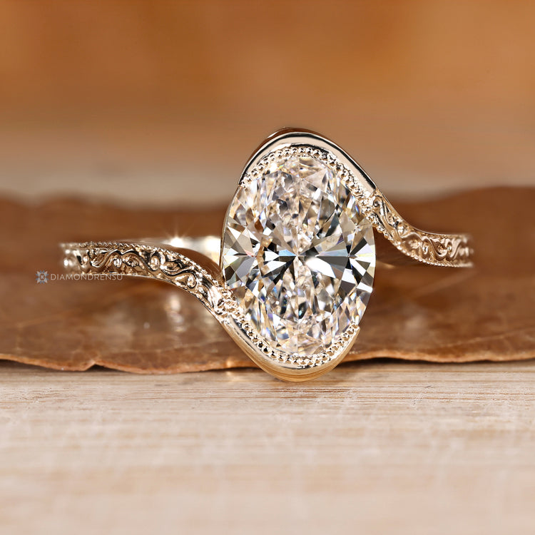 Lab grown oval diamond ring with bypass setting.