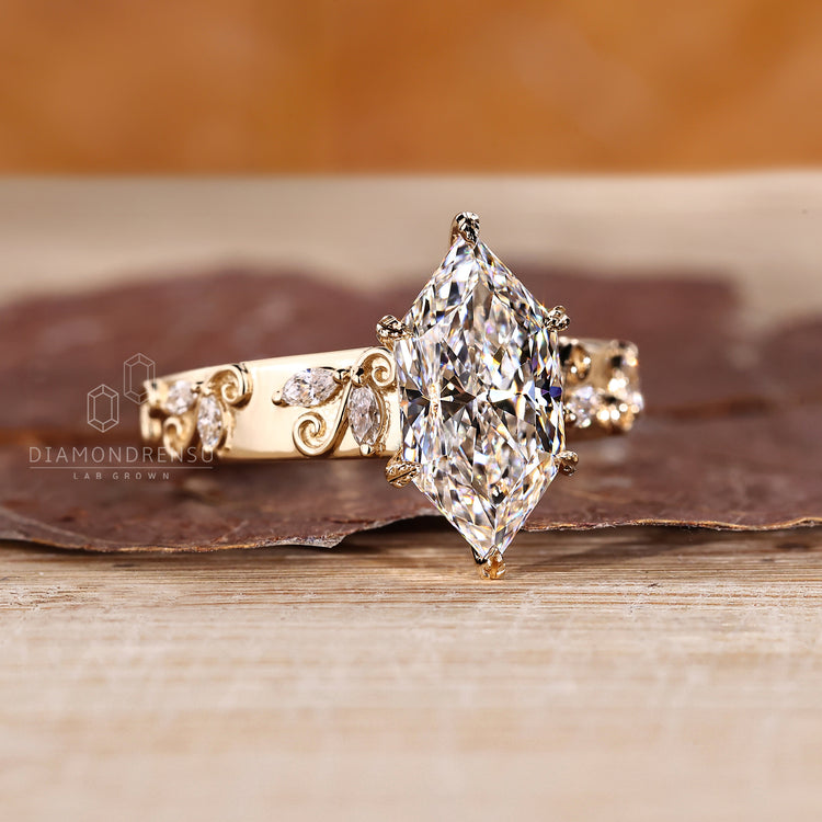 Lab grown marquise diamond ring with side stones and tapered band.