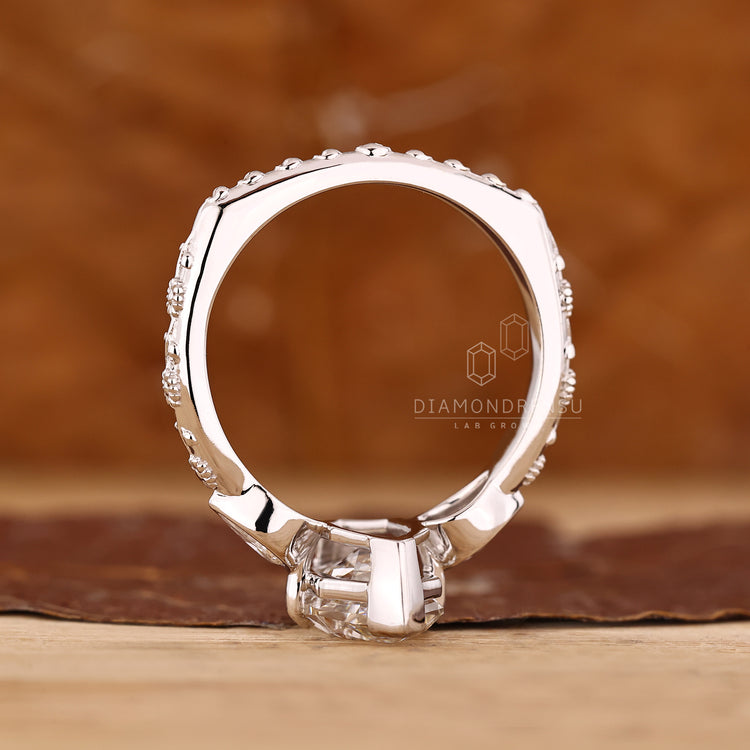 Handmade art deco ring with marquise centre diamond