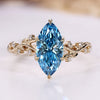 Marquise diamond ring with blue centre diamond and round side stones