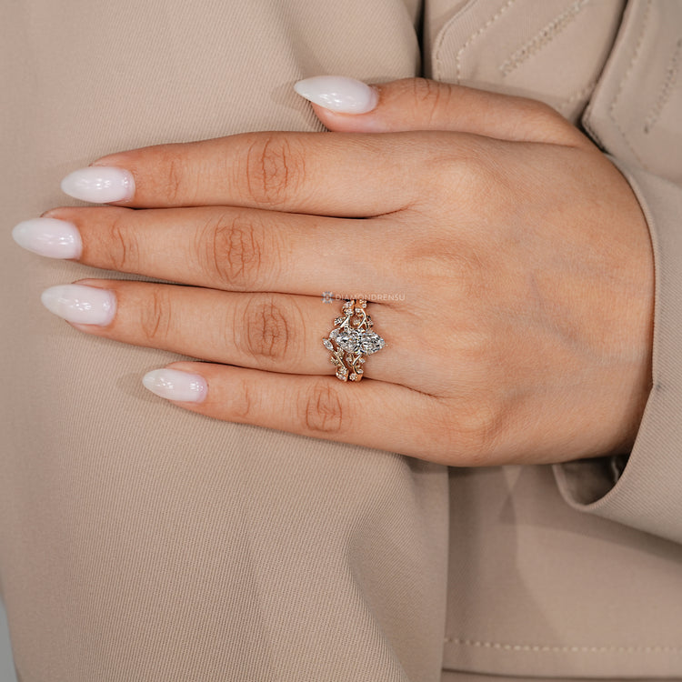 Nature inspired band with marquise and round diamonds.