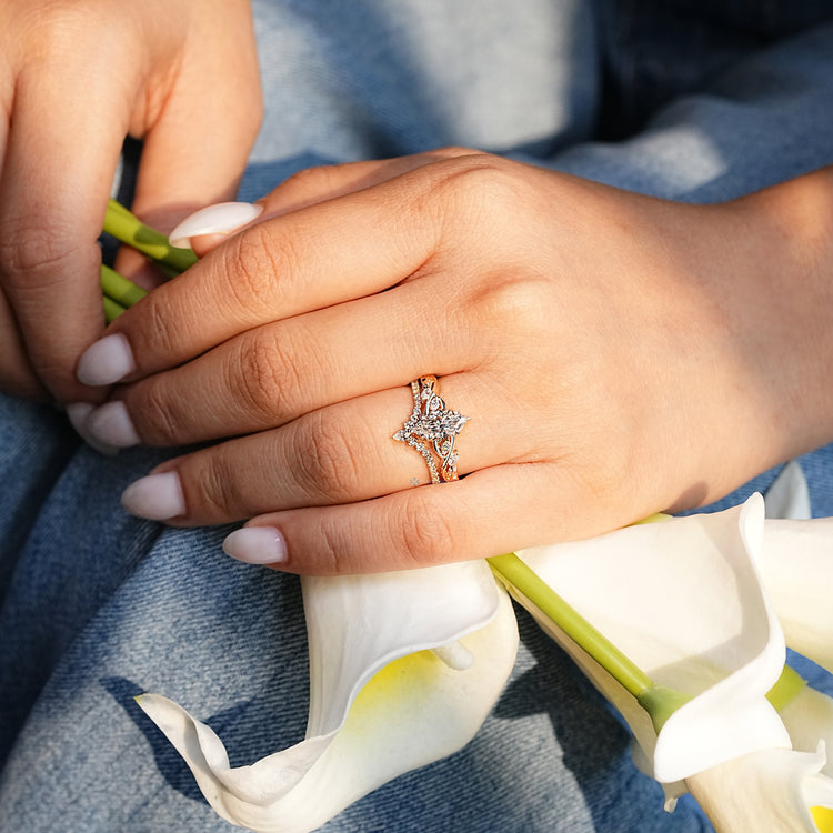 Marquise centre diamond with nature inspired ring design.