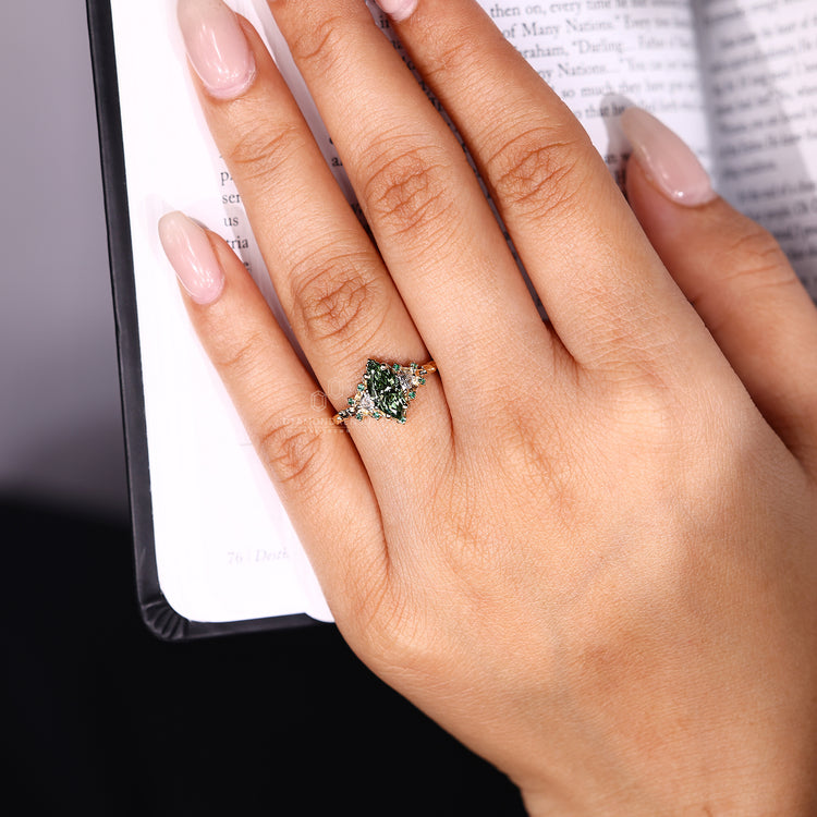 Handmade marquise cut ring with green round side stones.