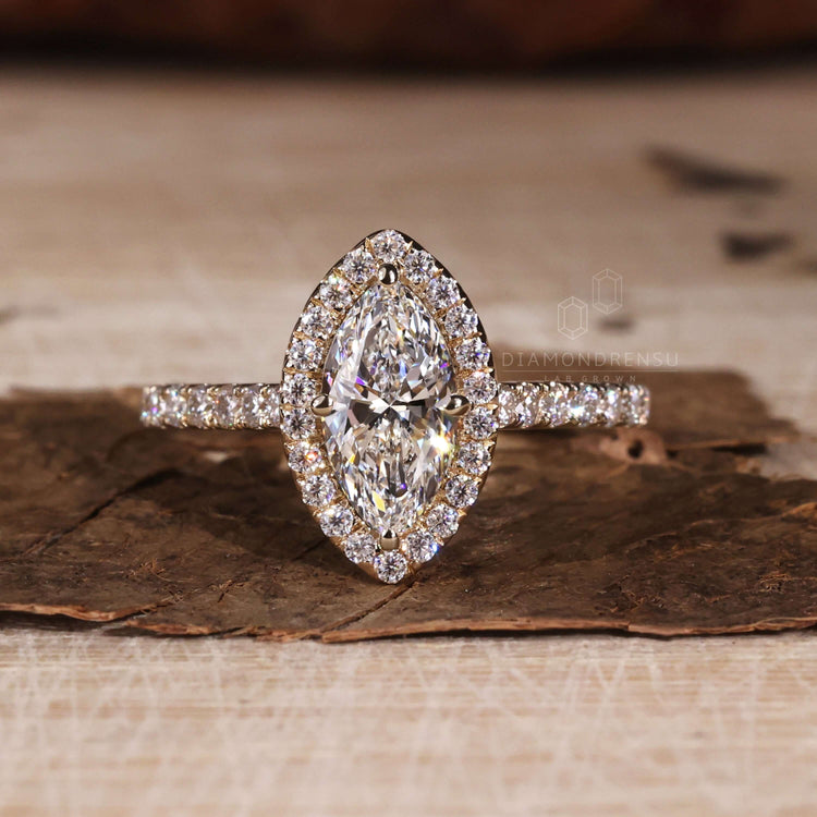 Marquise cut diamond highlighted in a cathedral setting ring
