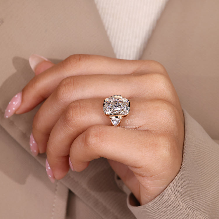 IGI certified cushion diamond ring with trillion accents.