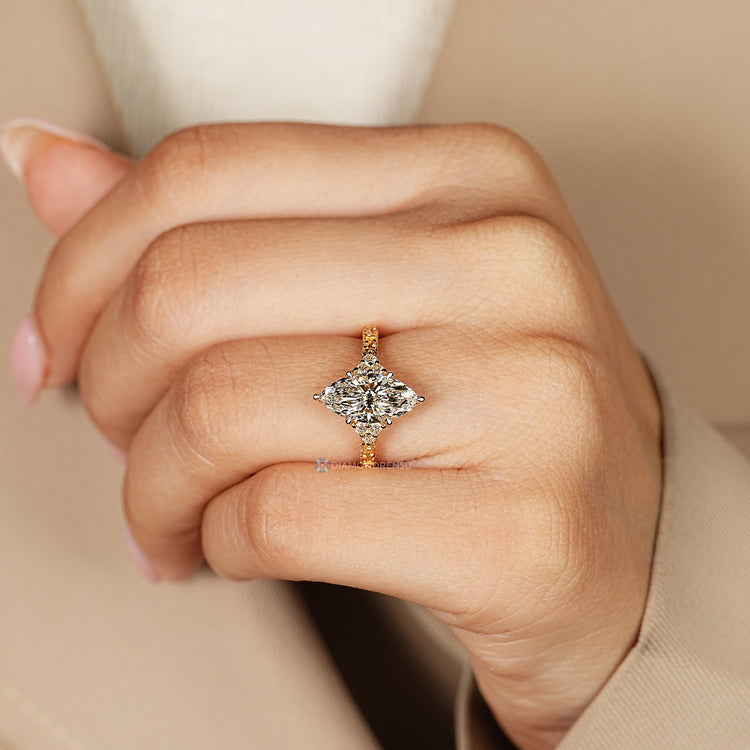 Marquise diamond ring with art deco milgrain details.