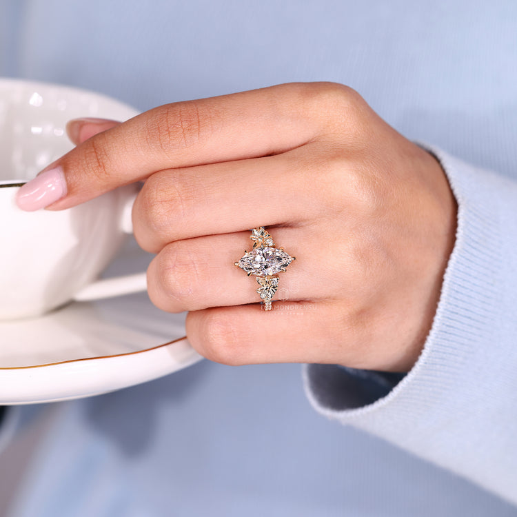 Nature inspired marquise ring with six claw prong.