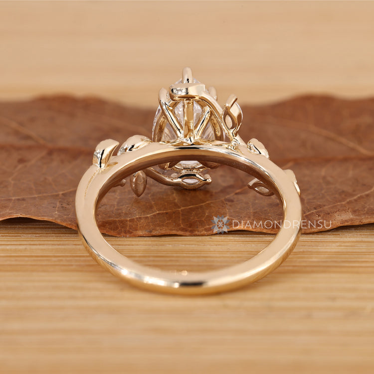 Handmade pear cut ring with bypass setting.