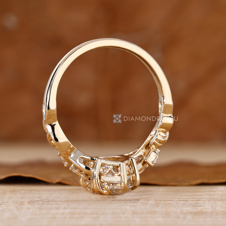 Lab grown marquise diamond ring with side stones.
