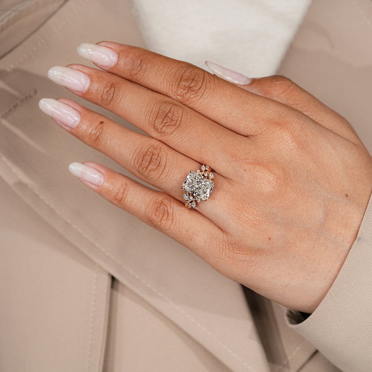 Lab grown radiant diamond ring with four claw prongs.