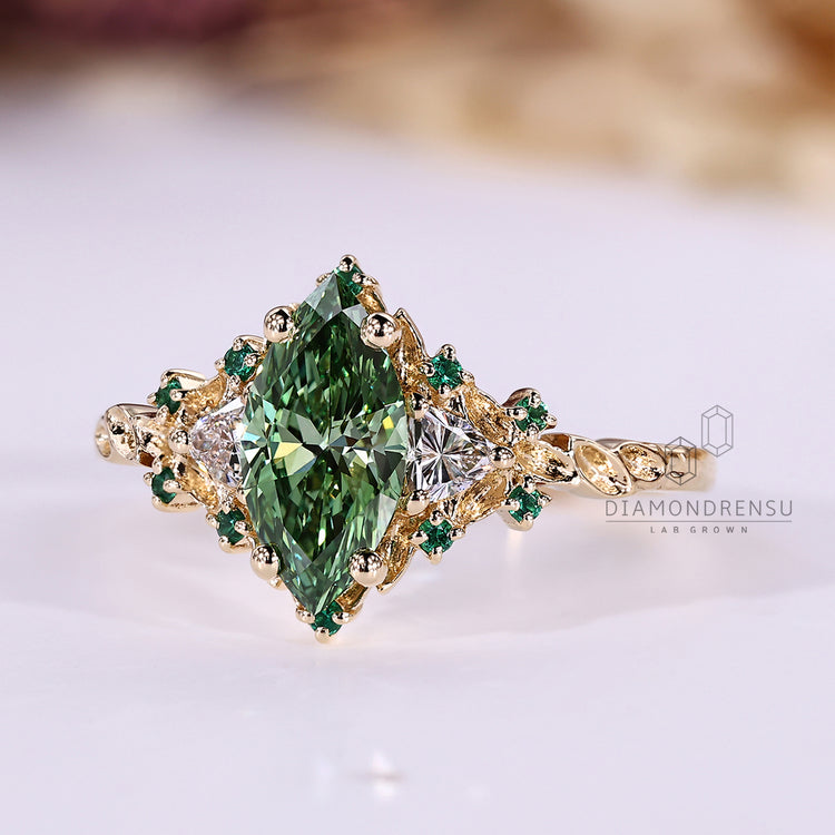 Marquise cut ring with trillion and round side stones.