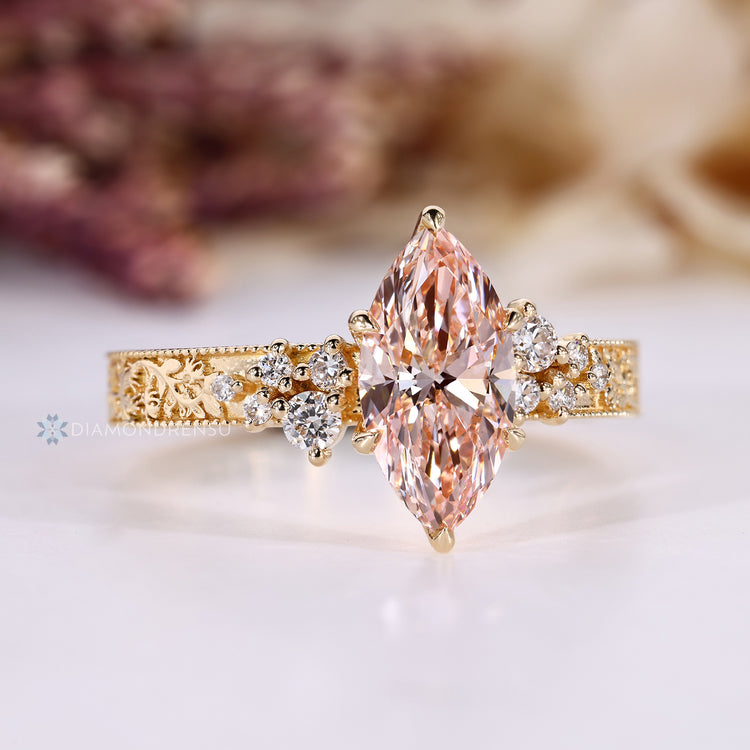 Vintage style ring with pink diamond and milgrain details.
