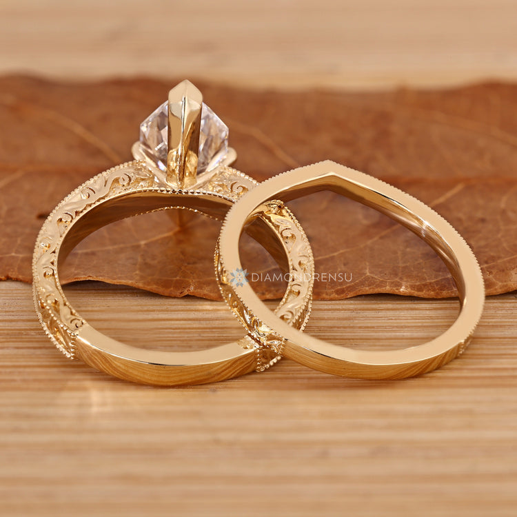 Dutch marquise diamond ring with curved shank design.