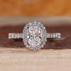 Cushion cut lab grown diamond ring with halo setting.