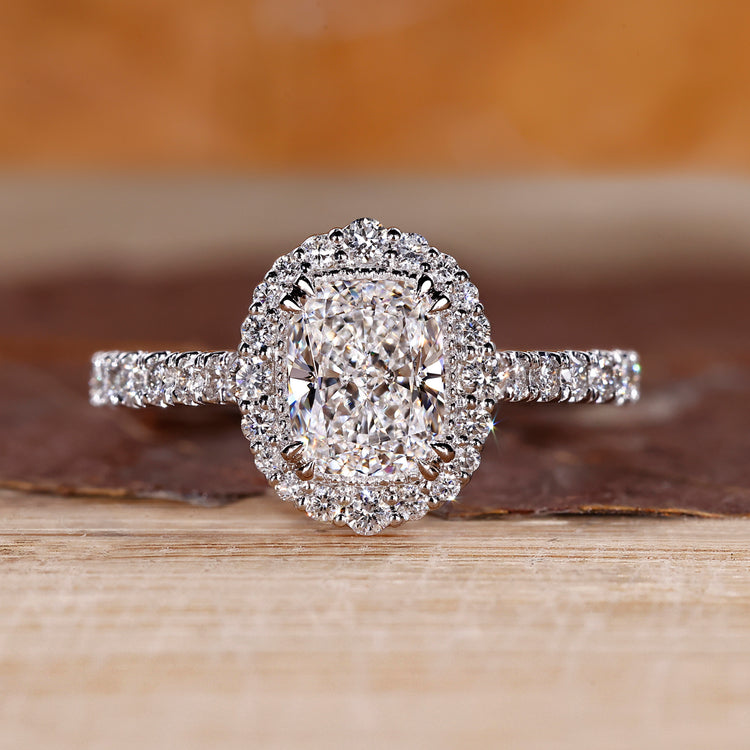 Cushion cut lab grown diamond ring with halo setting.