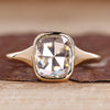 Bezel engagement ring with cushion rose cut diamond.