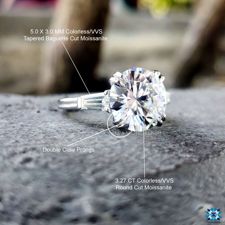 Three stone ring with prong setting in white gold.
