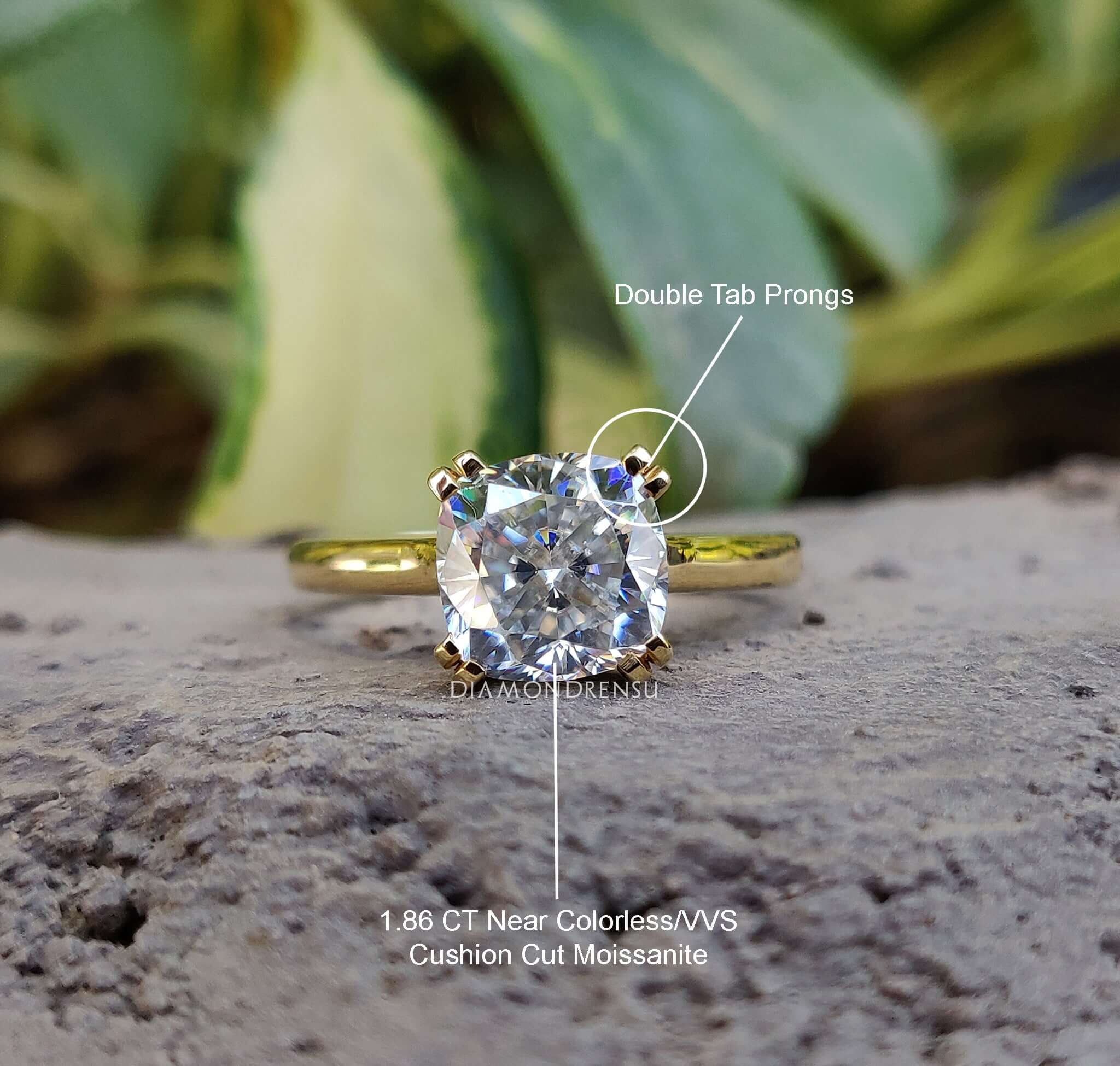 UK engagement ring in yellow gold with cushion cut moissanite center stone.