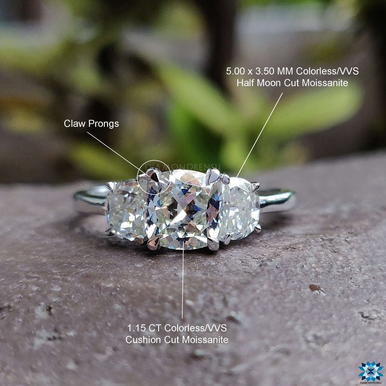 Handmade ring featuring a cushion cut ring with half moon ring accents.