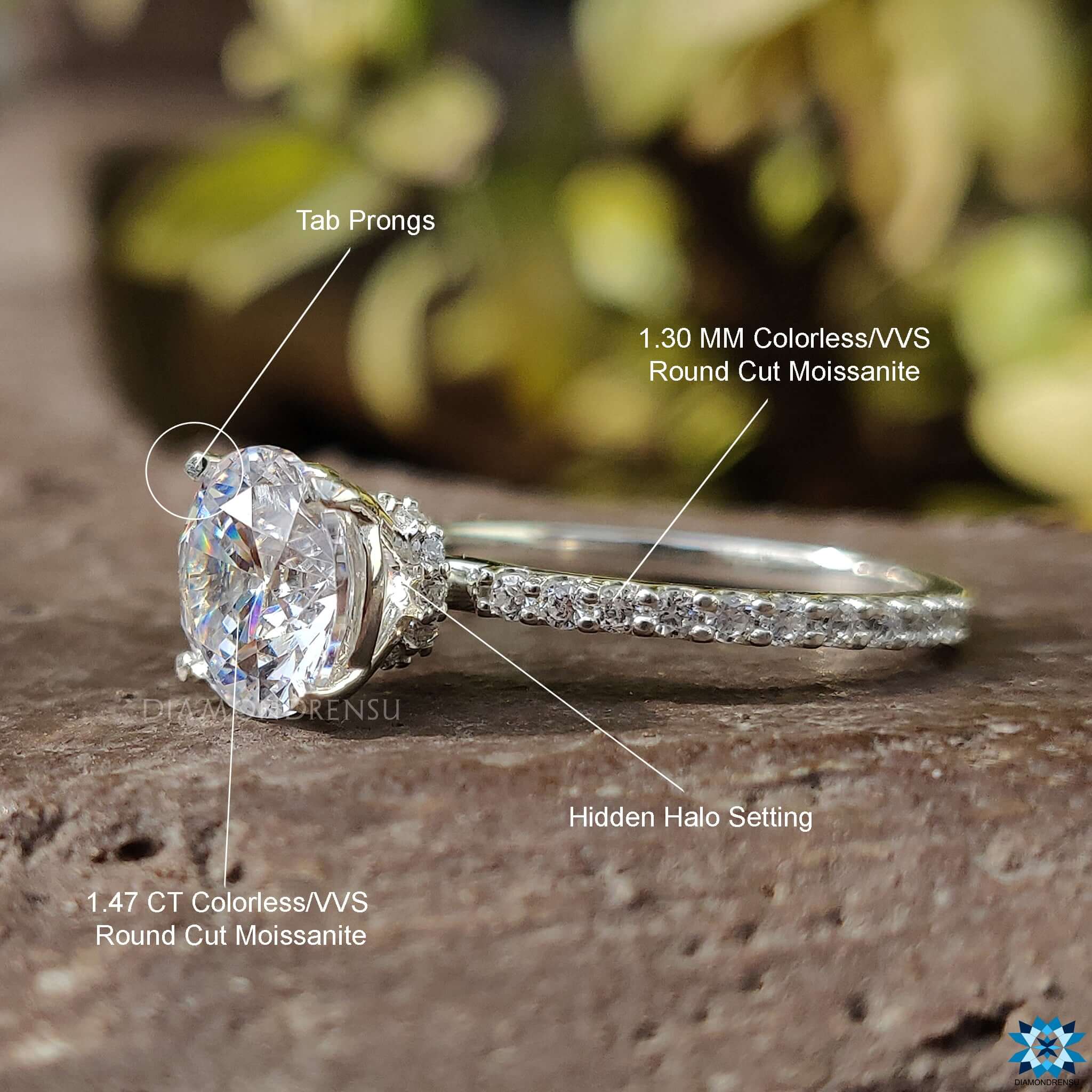 Handmade ring featuring a round cut moissanite centre with a pave setting.