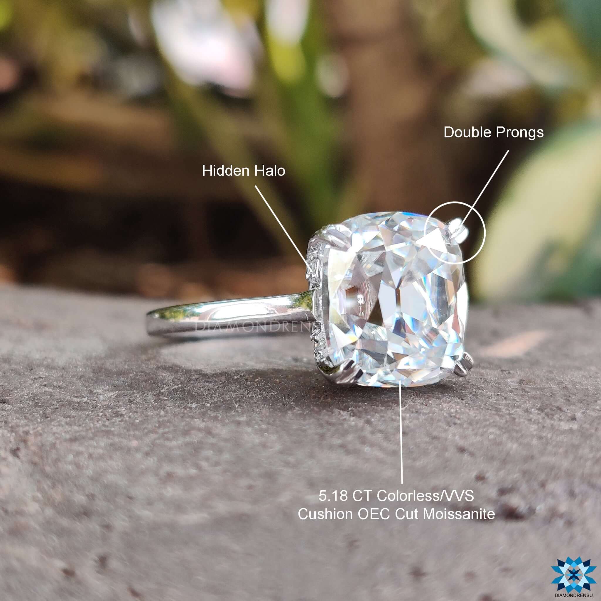 Custom ring featuring a stunning cushion cut engagement ring with a double prong setting.