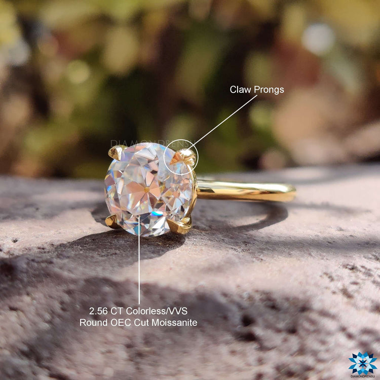Round cut moissanite solitaire ring in classic design.
